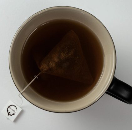 Tea bag steeping in a cup of 
ecuador cacao chocolate tea.